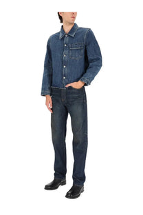 Our Legacy men’s cut rebirth jacket blue dark blue denim with button-up front and chest pockets paired with jeans
