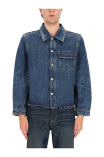 Our legacy men’s cut rebirth jacket blue medium-wash denim shirt with classic collar button front and frayed hem