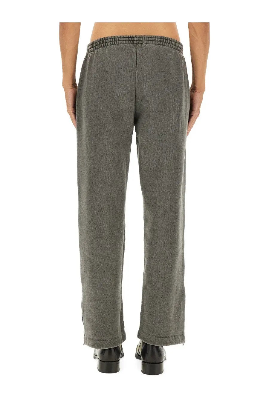 Our legacy men’s fleece pants grey made of gray corduroy with an elastic waistband shown from the front