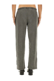 Our legacy men’s fleece pants grey made of gray corduroy with an elastic waistband shown from the front
