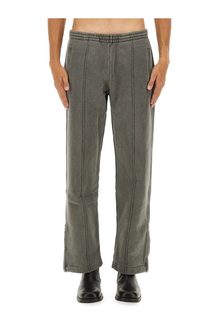 Our Legacy men’s fleece grey sweatpants with elastic waistband and vertical seam detailing in a relaxed fit