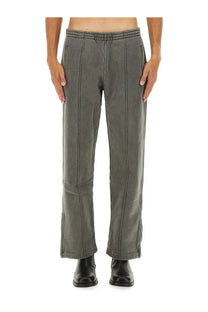 Our Legacy men’s fleece grey sweatpants with elastic waistband and vertical seam detailing in a relaxed fit