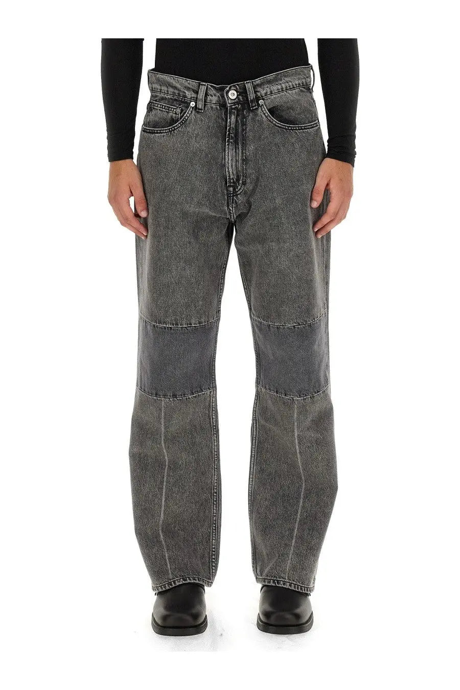 Dark gray wide-leg denim jeans with faded wash and reinforced knee patchwork from Our Legacy men’s collection