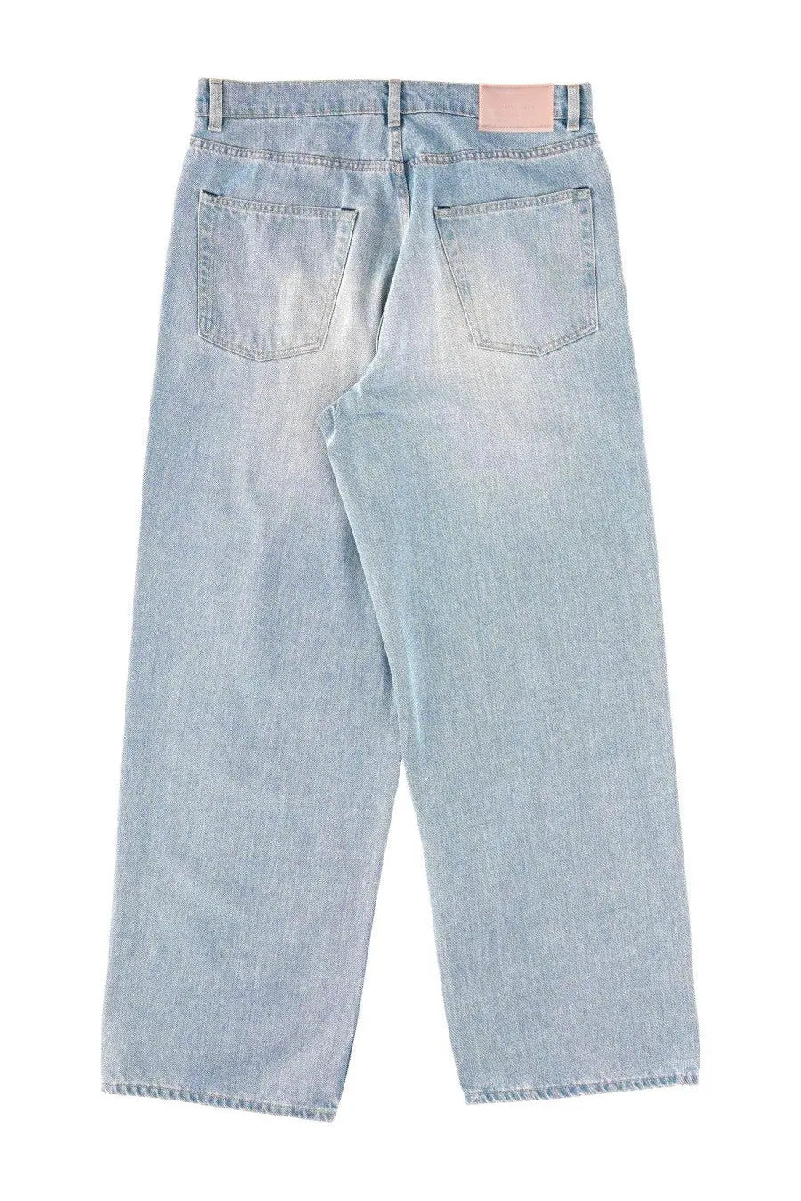 Our legacy men’s jeans vast cut blue light-wash denim with faded distressed finish and classic back pockets shown from back