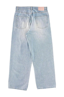 Our legacy men’s jeans vast cut blue light-wash denim with faded distressed finish and classic back pockets shown from back