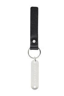 Our legacy men’s black leather keychain ring with silver metal tag engraved with our legacy logo
