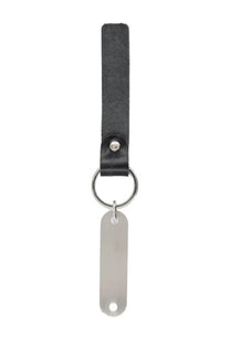 Our Legacy men’s keychain ring black featuring a black leather strap with a silver metal tag and ring
