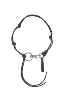Our Legacy men s Ladon necklace black featuring a black leather keychain with silver metal clasp and small black tag
