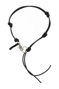 Our Legacy men’s leather keychain black featuring a black leather cord bracelet with silver clasp and decorative knots