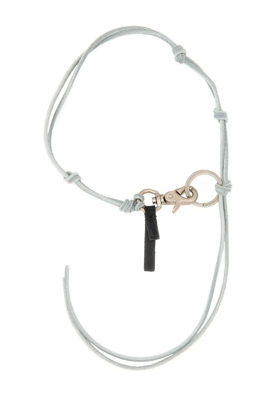 Our Legacy men’s leather keychain in blue with light gray cord, silver clasp, and black leather tag