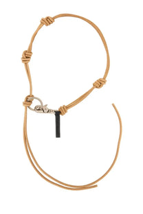 Tan leather cord necklace with silver-toned clasp and black tag for Our Legacy men’s leather keychain white product