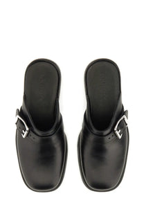Our legacy men’s mule camion black black leather mules with silver toned buckle details front view