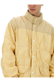 Our Legacy men’s beige nylon jacket with quilted puffer design white buttons and high collar