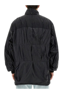Our legacy men’s black nylon puffer jacket with quilted panels and a high collar for cold weather use