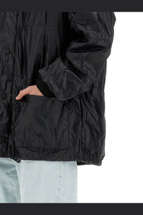 Our Legacy men’s black nylon puffer jacket with shiny quilted texture and button closures