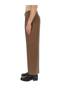 Our legacy men’s brown tailored trousers with straight-leg cut and subtle waist pleats in a sartorial design