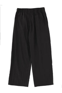 Our Legacy men’s pantaloni leisure black wide-leg trousers with elastic waistband and relaxed flowing fabric