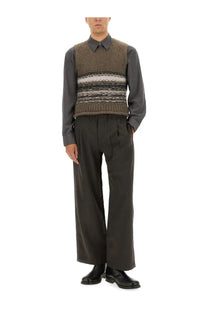 Our Legacy men’s pleaser tank vest multicolor earth-toned textured knit with horizontal stripes worn over a collared shirt