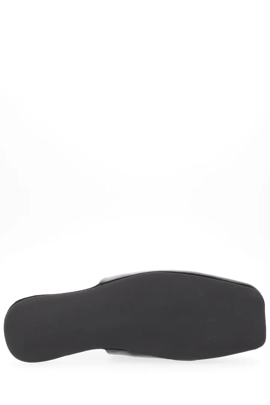 Our Legacy men’s slipper cigar black showing black rubber sole of minimalist slip-on shoe from the back side