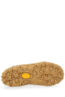 Tan rubber sole with a distinctive yellow vibram logo on our legacy men’s sneaker gabe beige