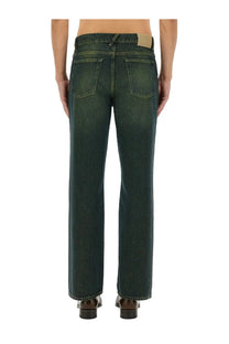 Our legacy men’s straight leg jeans in dark green denim shown from the back with classic pockets and straight cut