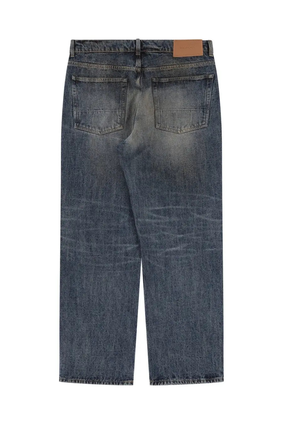 Our legacy men’s third cut jeans blue dark-wash denim with faded distressed look and brown leather waistband patch