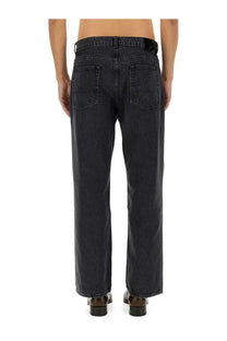 Our Legacy men’s third cut jeans grey showing the back side with dark-wash denim straight-leg cut and classic pockets