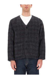 Dark gray textured knit wool blend cardigan with black buttons and two front pockets from our legacy menswear