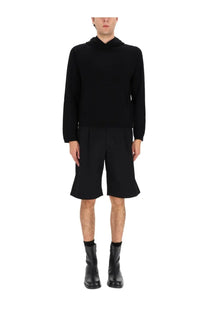 Our Legacy men’s black wool sweatshirt with a hood long sleeves and a relaxed fit shown from the back