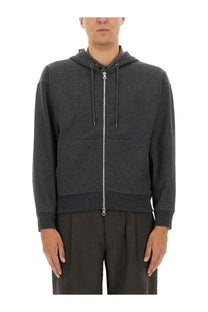 Our legacy men’s zipper rascal sweatshirt grey is a dark gray textured zip-up hoodie with silver zipper and matching drawstrings