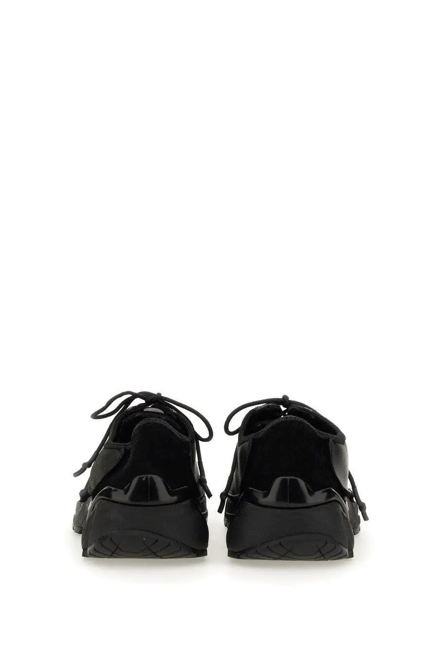 Black patent leather sneakers with chunky sole and laces from Our Legacy unisex Klove sneaker collection