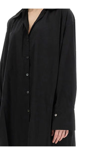 Our Legacy women’s chemisier dress Gale in black features an oversized relaxed fit and subtle sheen button-down shirt style