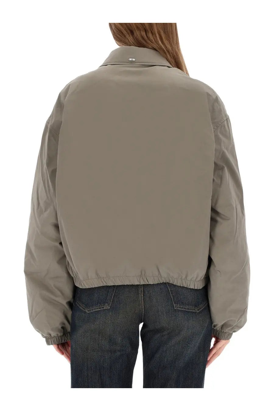 Our legacy women’s cropped avenue puffa jacket in taupe with puffer style, relaxed fit, and elastic cuffs