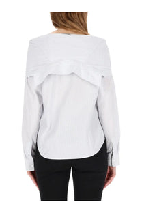 Our legacy women’s kaonashi white blouse with subtle vertical stripes and ruffled shoulder detail is stylish and elegant