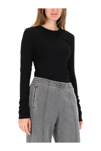 Our Legacy women’s black long sleeve shirt features a round neckline and subtle ruching along the shoulders