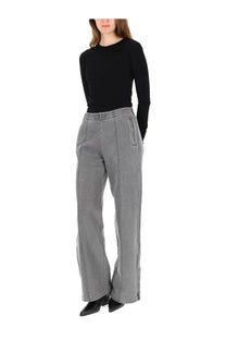 Our Legacy women’s lounge pants black with relaxed fit gray wide-leg trousers featuring subtle vertical stitching and pockets