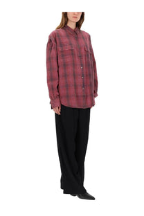 A relaxed-fit long-sleeved button-up shirt in faded red and black plaid with two chest pockets paired with our legacy women’s pants robe black