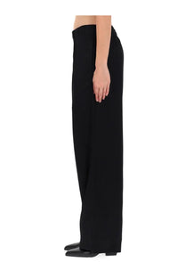 Our Legacy women’s black wide-leg trousers with sleek minimalist design in robe style perfect for modern wear