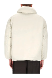 Lemaire men’s blouson jacket in cream-colored quilted puffer design with a high collar for warmth and style