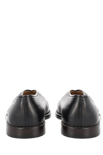 Lemaire men’s black leather flat piped slippers with polished finish and dark brown soles for formal wear