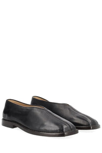 Lemaire men’s black leather slip-on loafers with sleek minimalist design and subtle stitching details
