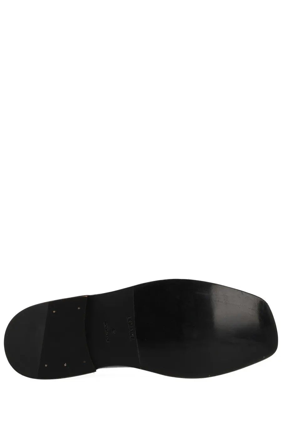 Black rubber sole with glossy finish and embossed branding on lemaire men’s flat piped slipper black back side