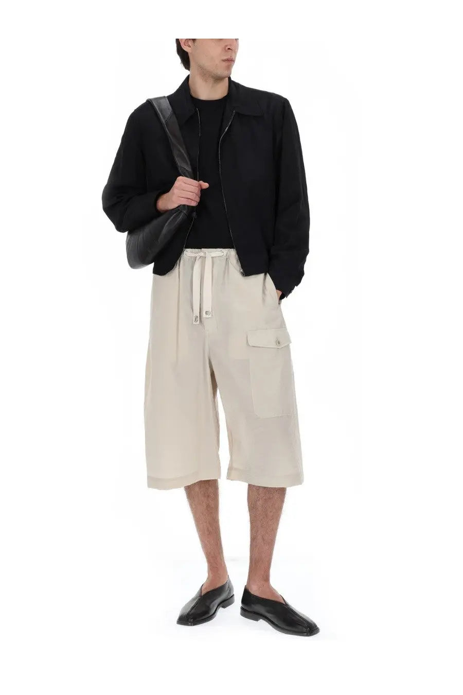 Beige cargo shorts with drawstring waist and side pockets complementing lemaire men’s giacca crop con zip black jacket