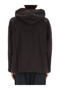 Black hooded jacket with a relaxed minimalist design and smooth fabric in lemaire men’s hoodie grey style