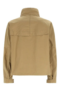 Back view of lemaire men’s parka short rain beige utility jacket with high collar and two horizontal back seams