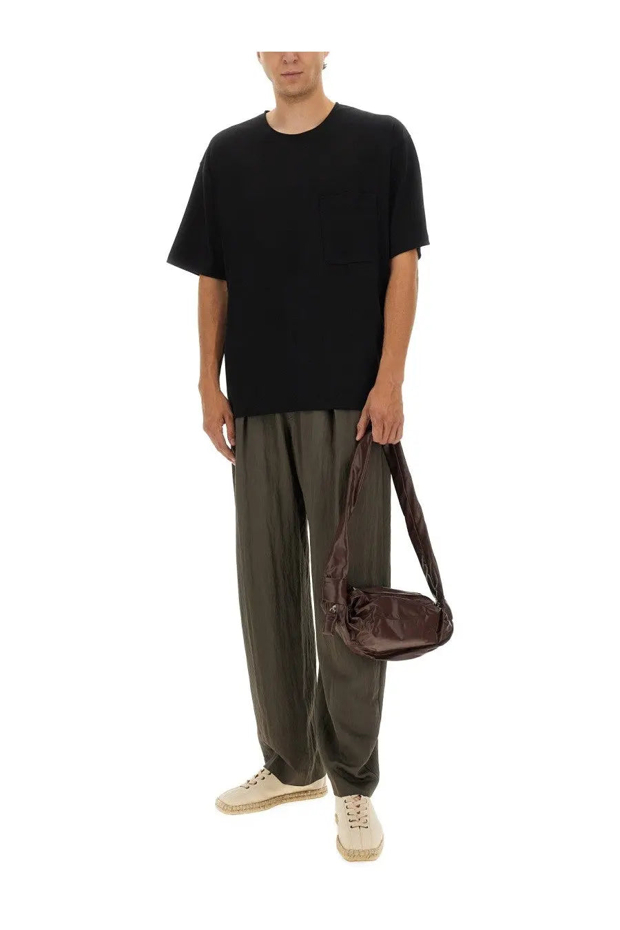 Lemaire men’s relaxed fit shirt black paired with a sleek dark brown leather crossbody bag with adjustable strap