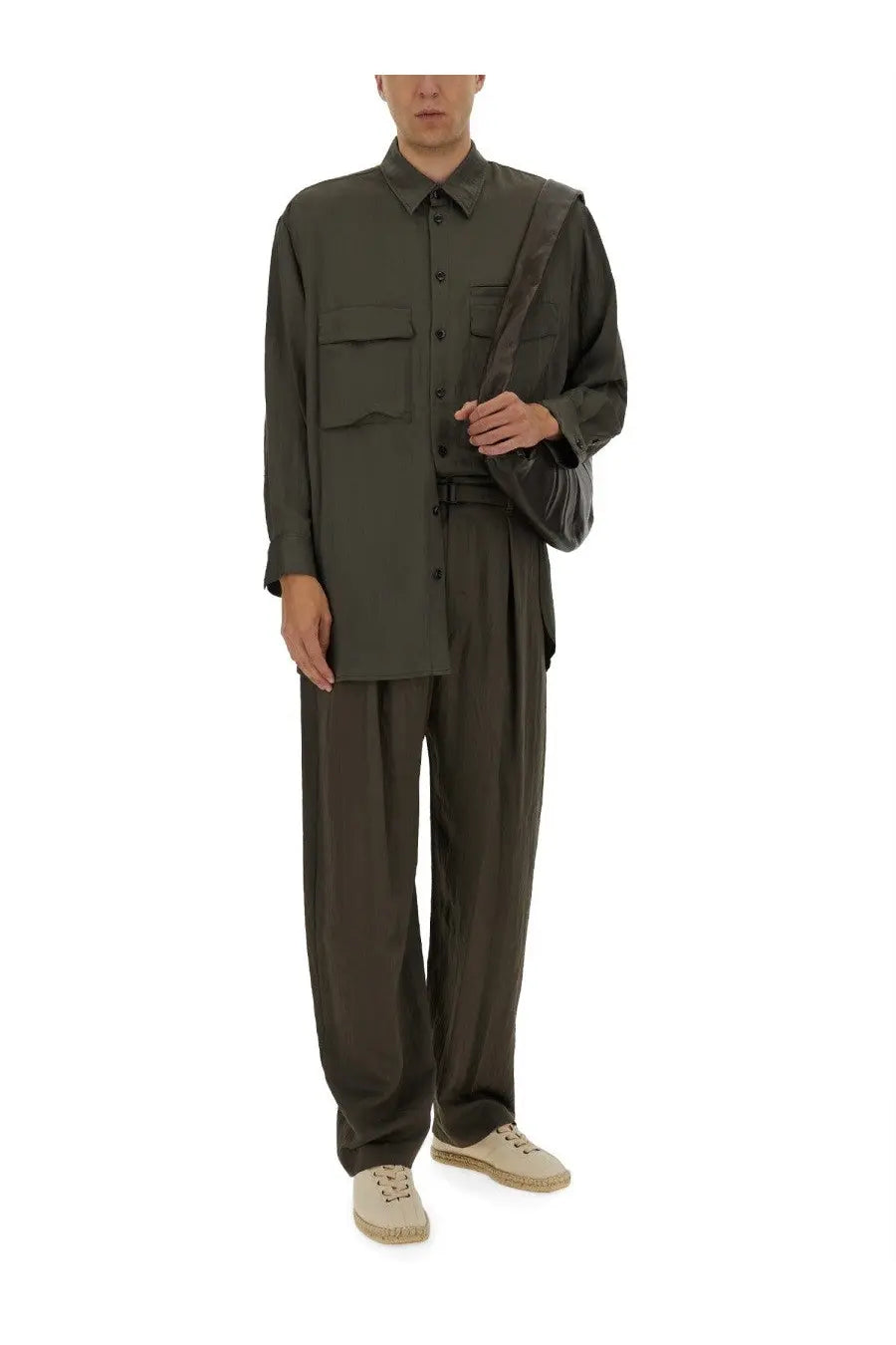 Olive green oversized button-up shirt with two chest pockets and draped shoulder detail paired with lemaire men’s relaxed pants green