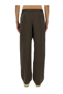 Lemaire men’s relaxed olive green wide-leg trousers with minimalist design and subtle front pocket detailing