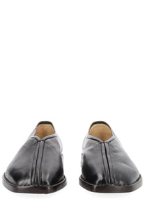 Lemaire women’s flat piped slipper in black leather slip-on style with sleek minimalist design and subtle stitching details