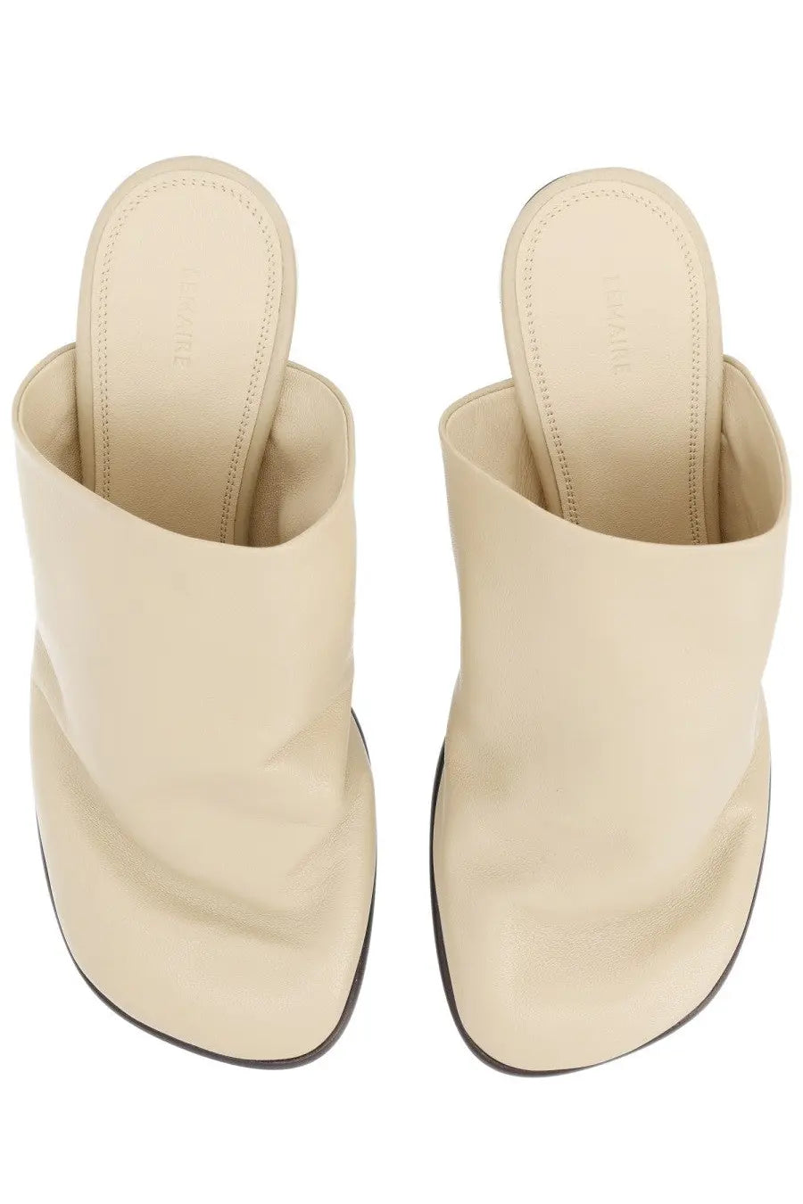 Cream-colored leather mules with minimalist design and black soles from lemaire womens mule glove beige collection